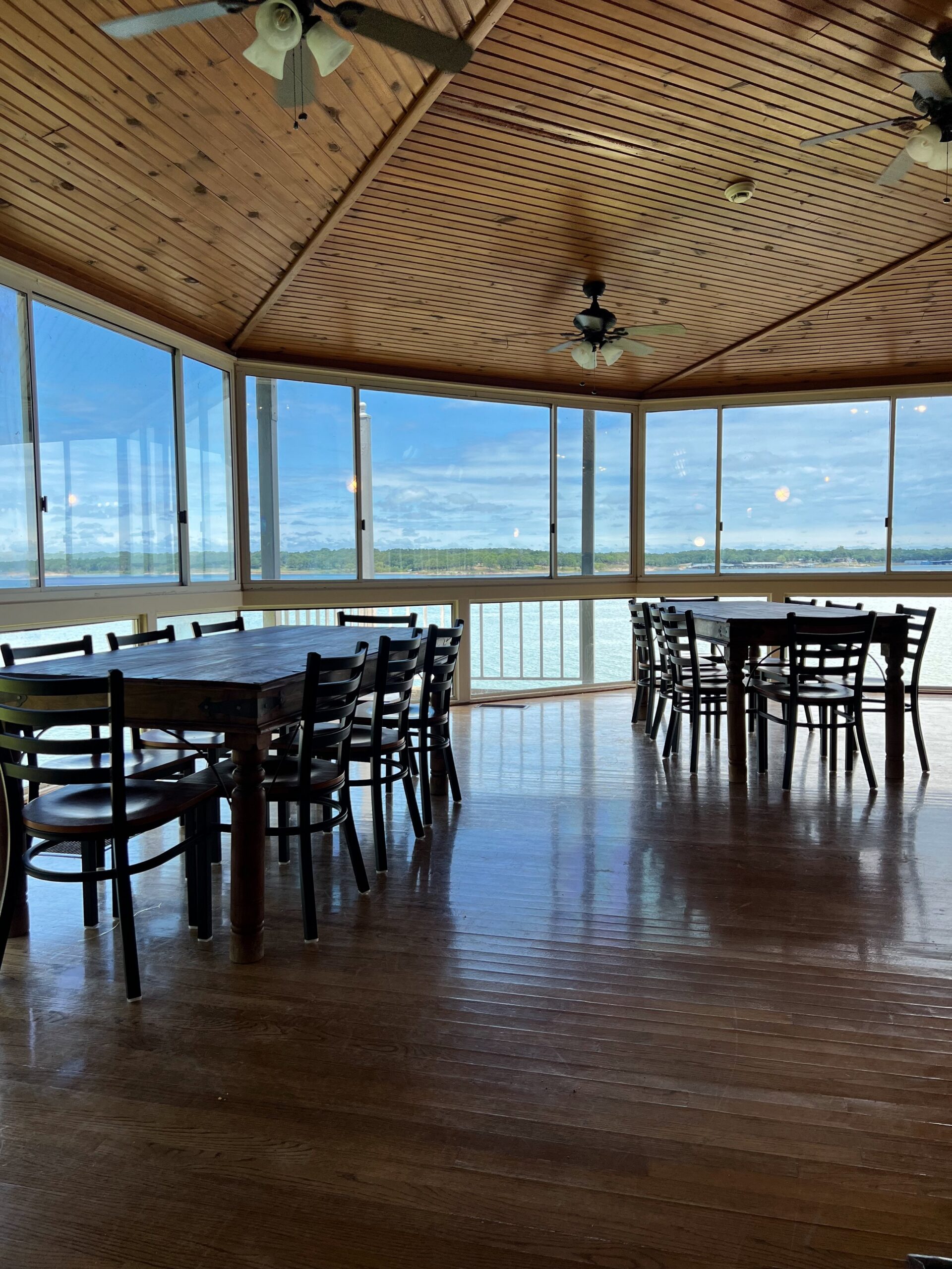 Dining area with windows overlooking the lake