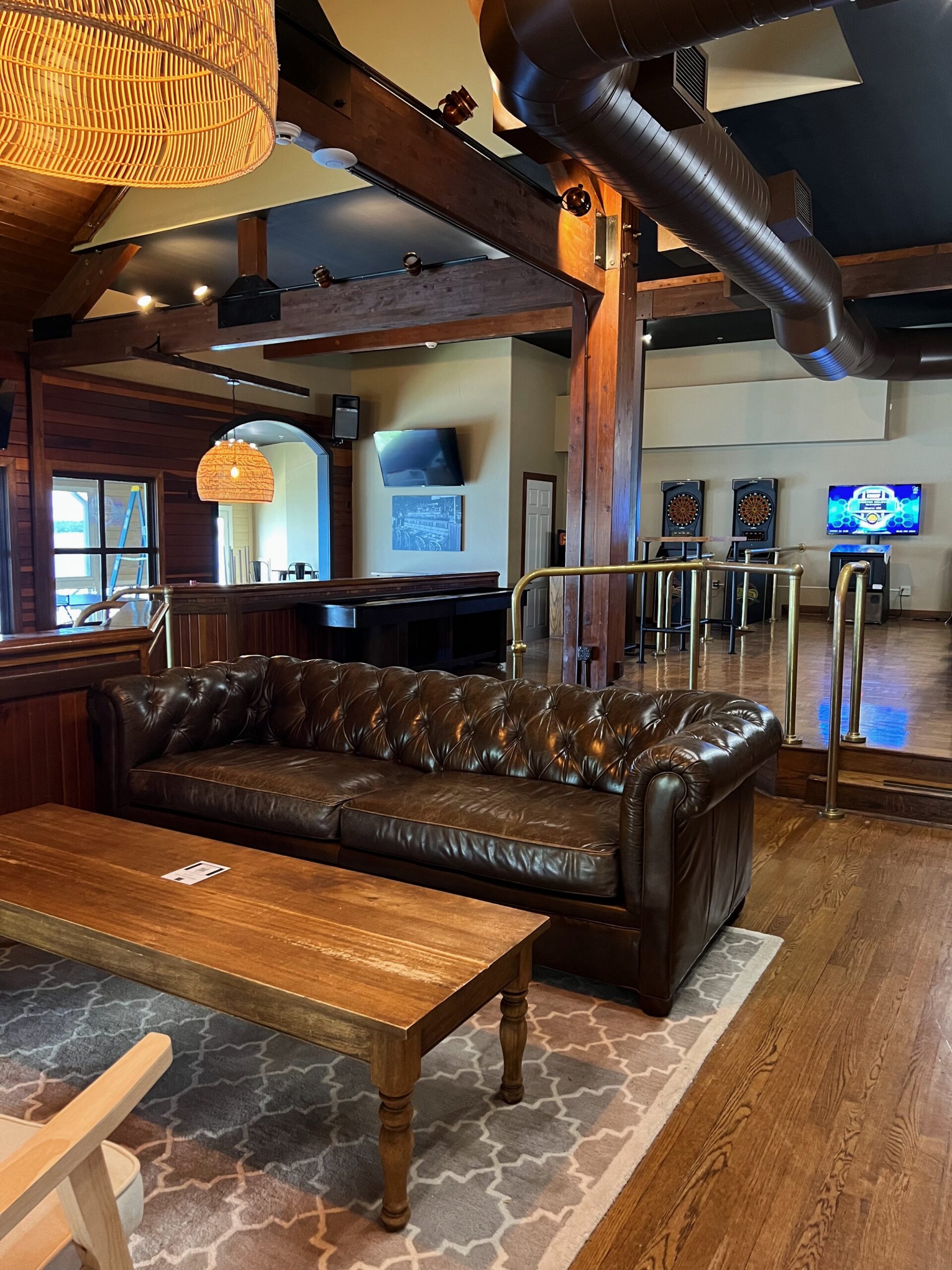 The Parlor Room lounge with a leather sofa and the bar